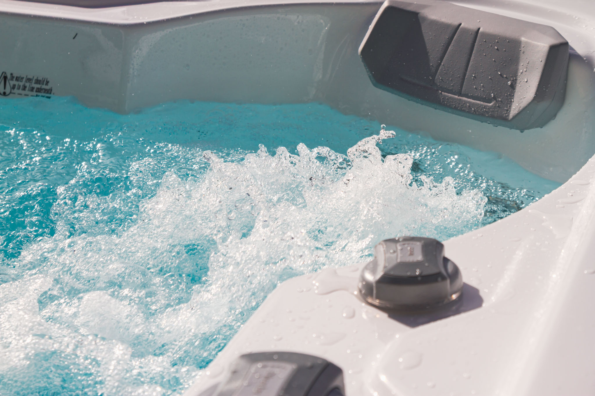 Close-up of bubbling water inside a luxury hot tub